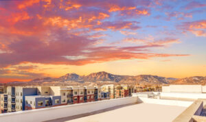 Exterior View from the roof of Depot Square with the city and mountains in the background, Photo taken at sunset.