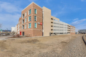 Exterior Depot Square, red brick 4 story building, photo taken on a sunny day.